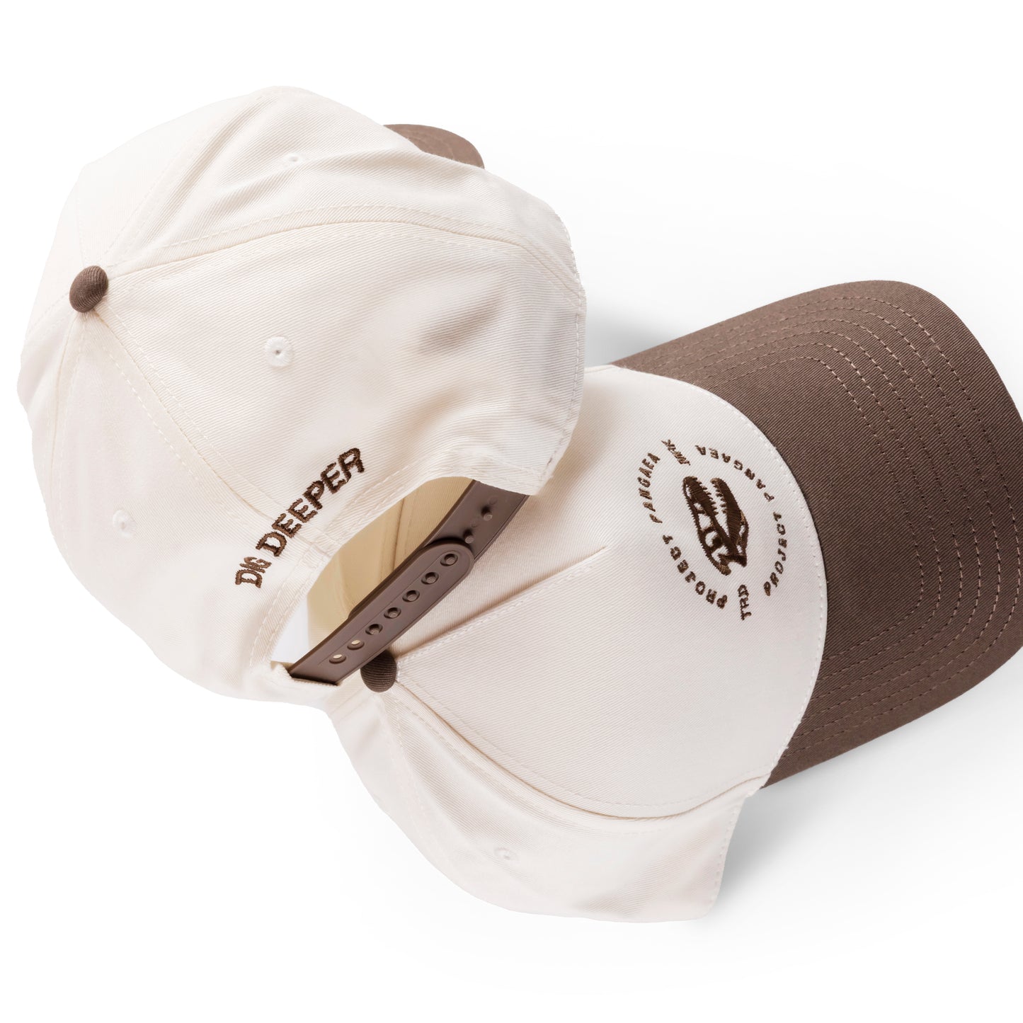 t-rex hat / T. Rex hat
100% cotton hat with curved peak. 
Embroidered Tyrannosaurus rex skull design with Project Pangaea stitched above and below T. Rex skull. TRD MRK written on the sides. Brown bill. cream cap. "dig deeper" stitched on the back. 