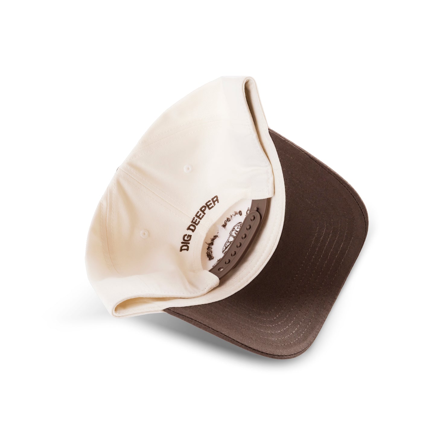 back of t-rex hat
100% cotton hat with curved peak. 
Brown bill. cream cap. "dig deeper" stitched on the back. 